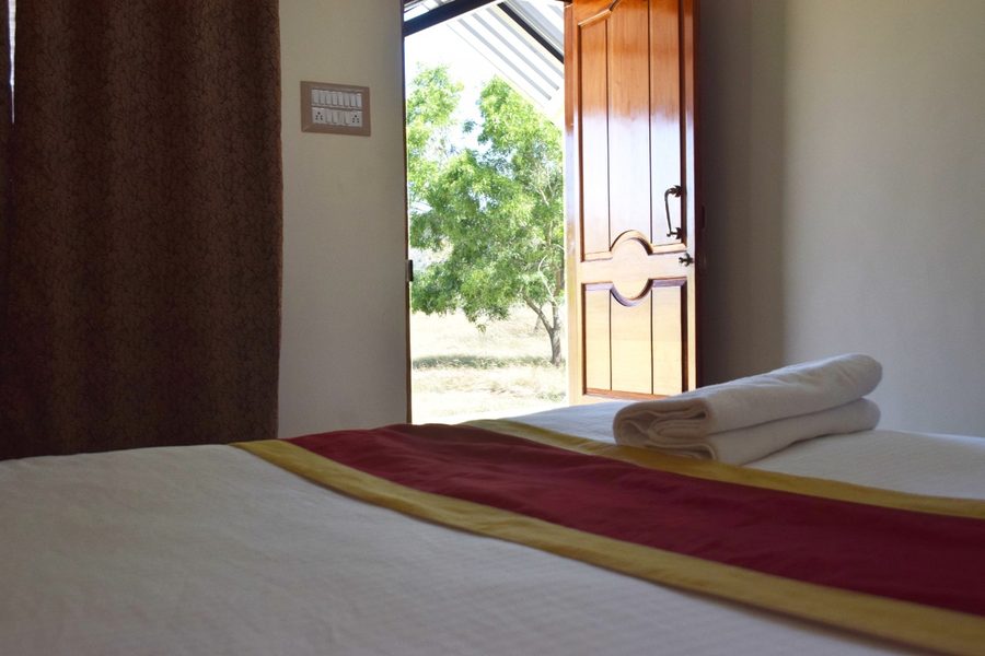 Garden View Room at Bandipur Hill View Homestay with open door to garden