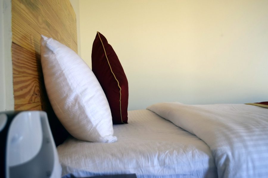 Room detail showing premium quality white bedding and pillows